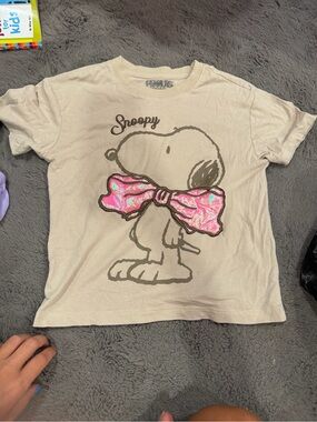 Peanuts Beige Snoopy Tee with Pink Iridescent Bow